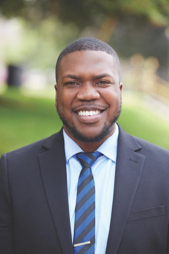 Jerome Burke, Director of the Center for Inclusive Excellence, wearing a dark suit.